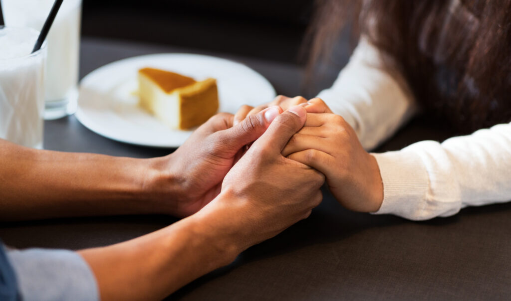Large Vecteezy Cropped Of A Guy And A Girl Are Seated At A Table Holding 50845720 Large 1024x604