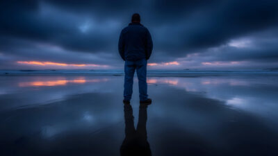 Large Vecteezy Man Stands On Beach Watching Ocean Sunset 70370287 Large