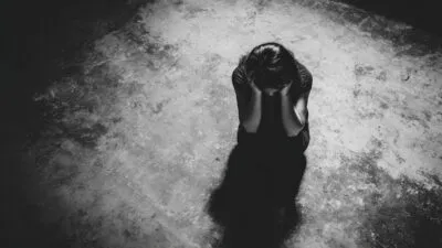 Large Vecteezy A Woman Is Standing In The Dark With Her Hands On Her Head 69962781 Large